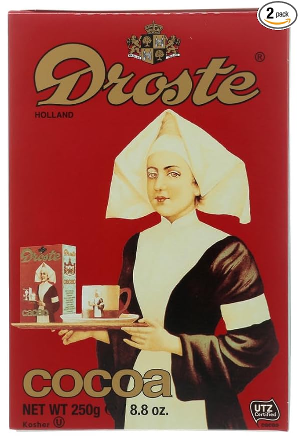 Image of a package of Droste cocoa powder. The package shows a woman holding a tray, on which is a box of Droste cocoa powder (showing the same image of a woman holding a tray, on which is a box of Droste cocoa powder, showing the same image of a woman holding a tray...).