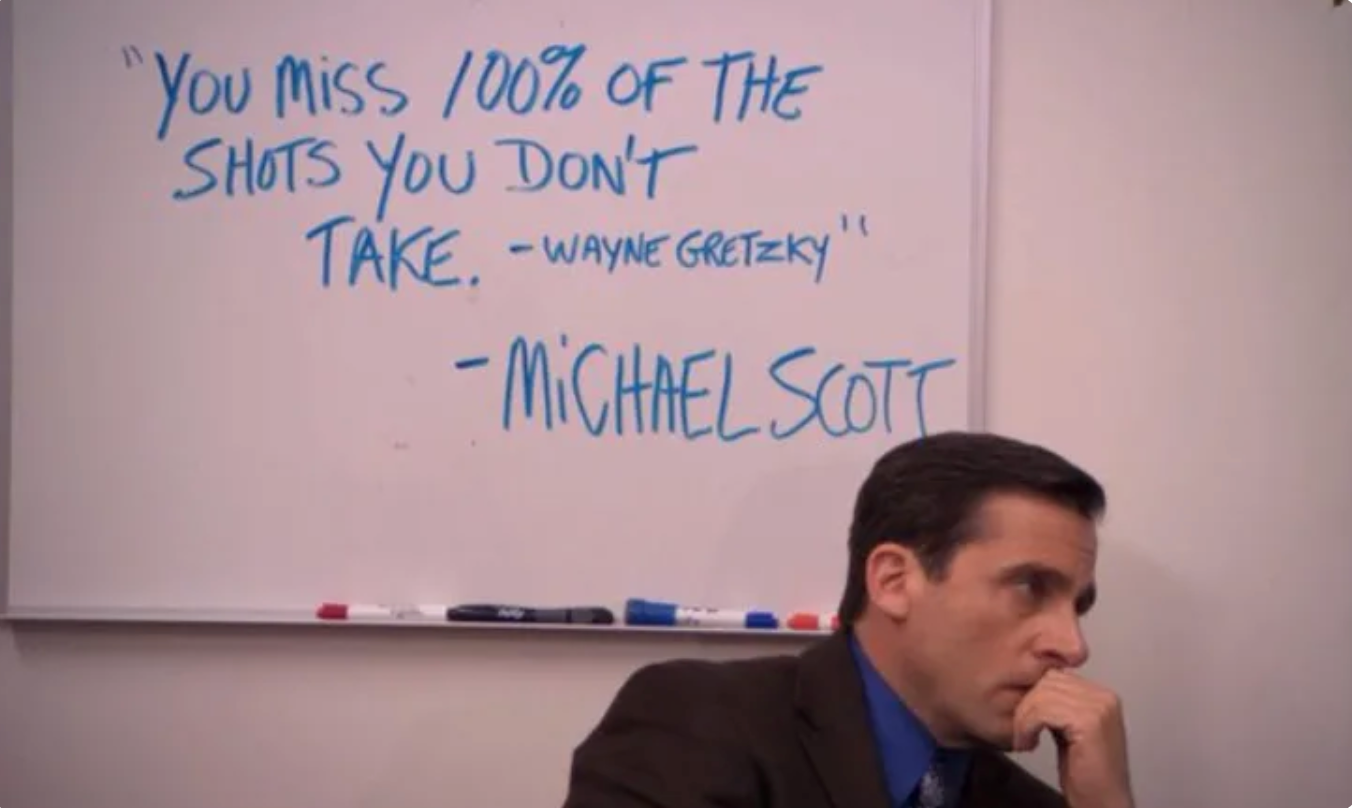 Screenshot from The Office showing Michael Scott in front of a whiteboard saying You miss 100% of the shots you don't take. - Wayne Gretzky - Michael Scott.